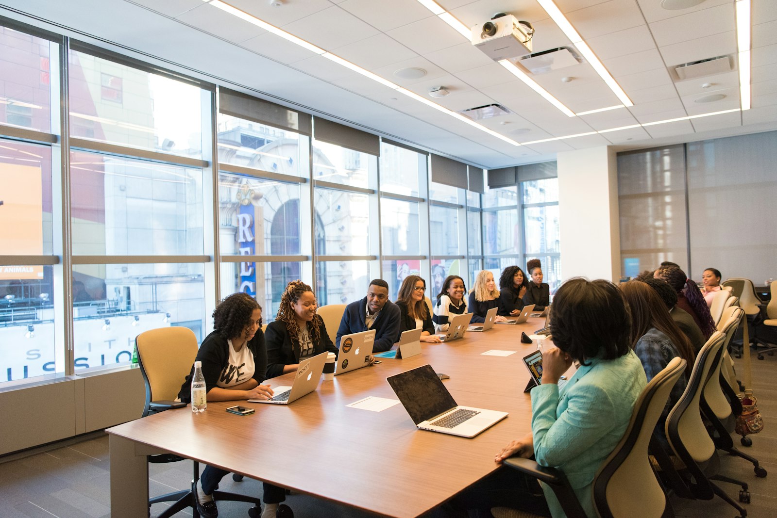 A benefits team working together in a bright conference room